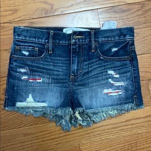 Distressed denim shorts size 25